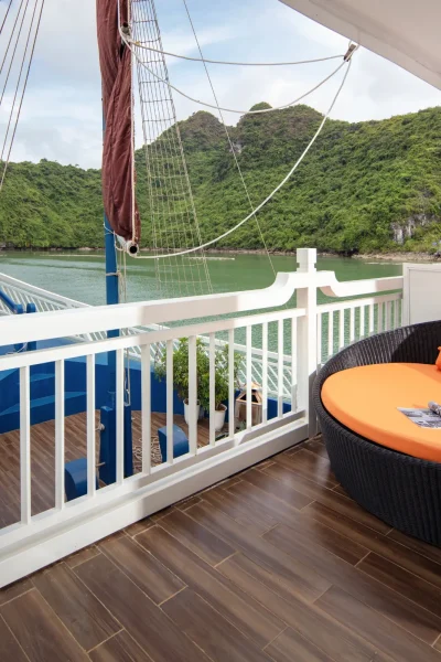 balcony with lounge chair and scenic island view
